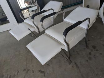 Pair of white barber beauty chairs