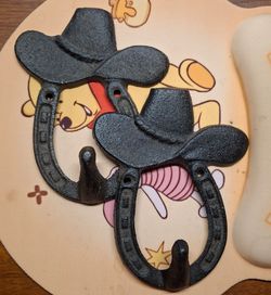 Rustic cast iron cowboy hat and horseshoe wall hooks