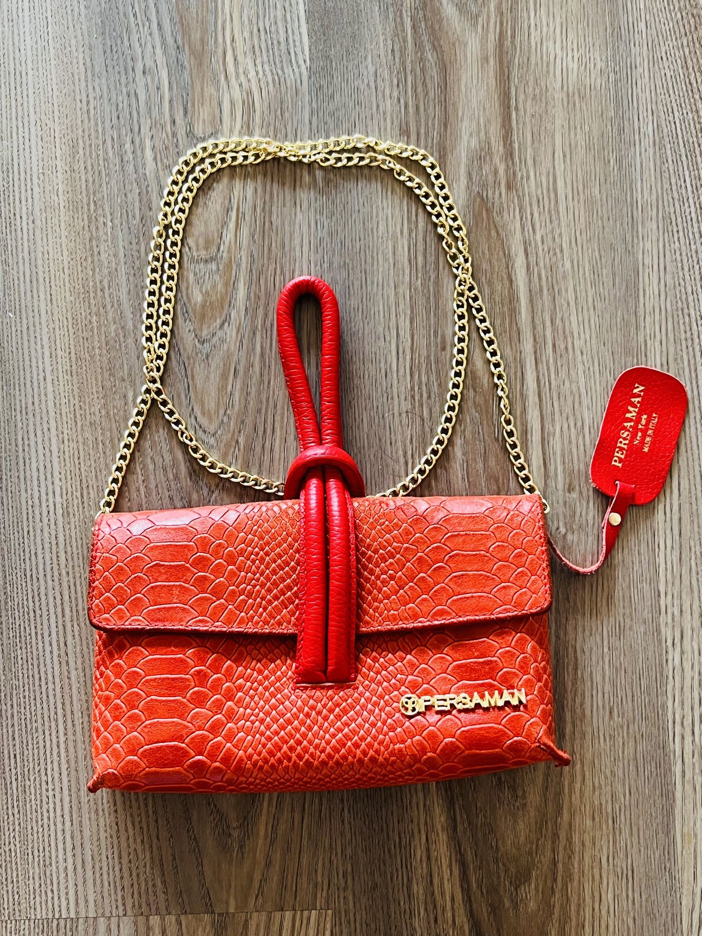 Authentic Persaman New York Red Crossbody Bag with Gold Hardware and Textured Finish