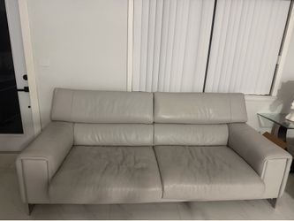 Good gray leather couch and glass table