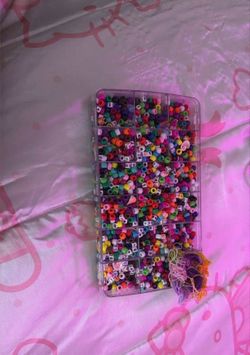 Beads for bracelets, sea shells, charms, letter charms, thread for the bracelets.