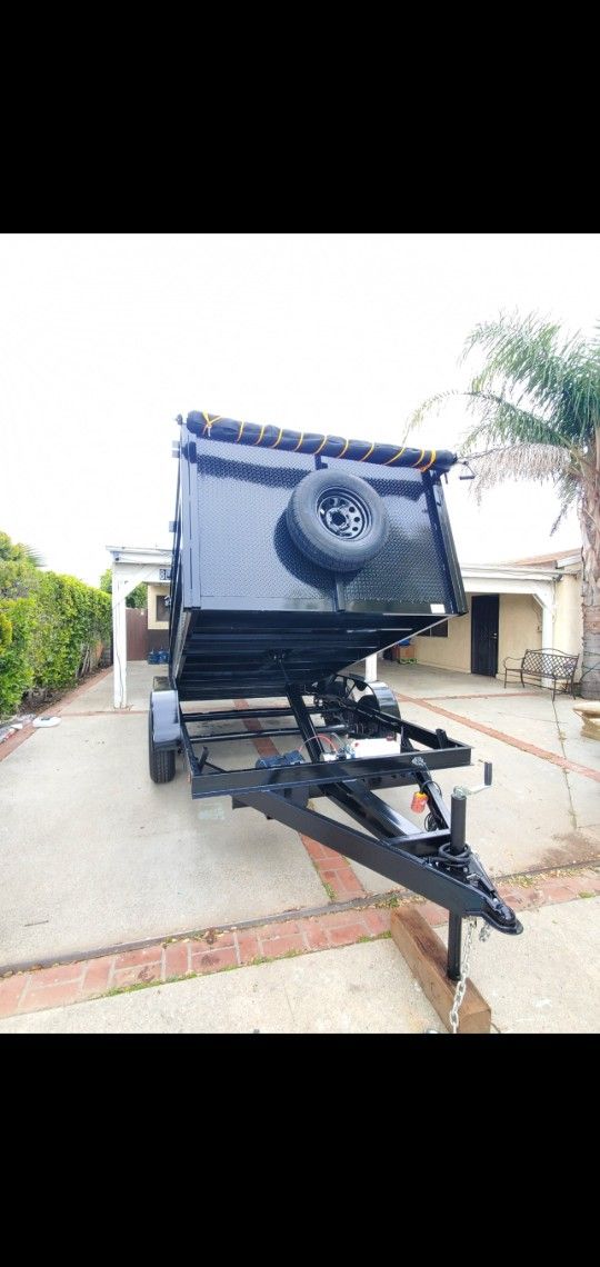 BRAND NEW DUMP TRAILER 8X12X4 12,000 LBS HYDRAULIC SYSTEM ROLLING TARP AND SPARE TIRE LED LIGHTS TITLE IN HAND READY FOR WORK FOR ANY QUESTION TEXT ME