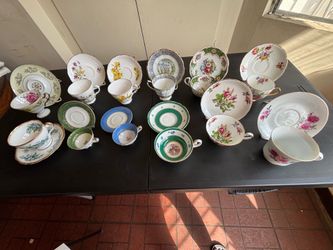 Antique tea, cups, and saucers