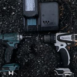 Makita Drill And Impact Driver 1 Battery And A Quick Charger 