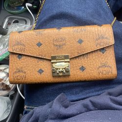 MCM clutch with hidden strap