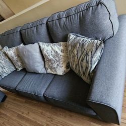 Grey couches, excellent condition (less than 2 years old) 6 pillows. 