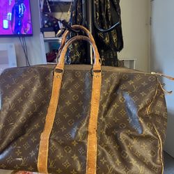 Louis Vuitton logage bag for men in women