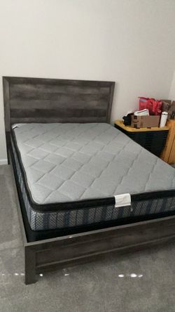Queen size bed with boxspring, mattress, and bed frame with headboard