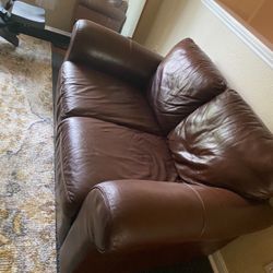Brown leather loveseat