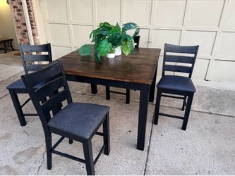 Solid refinished counter height wood table