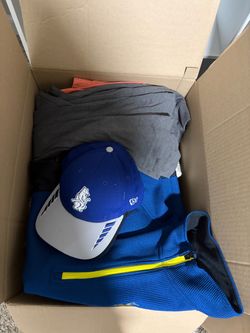Box full of new and used clothes