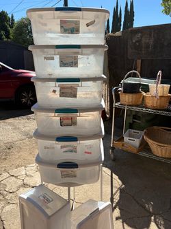 Assorted Storage Containers With Laundry Baskets