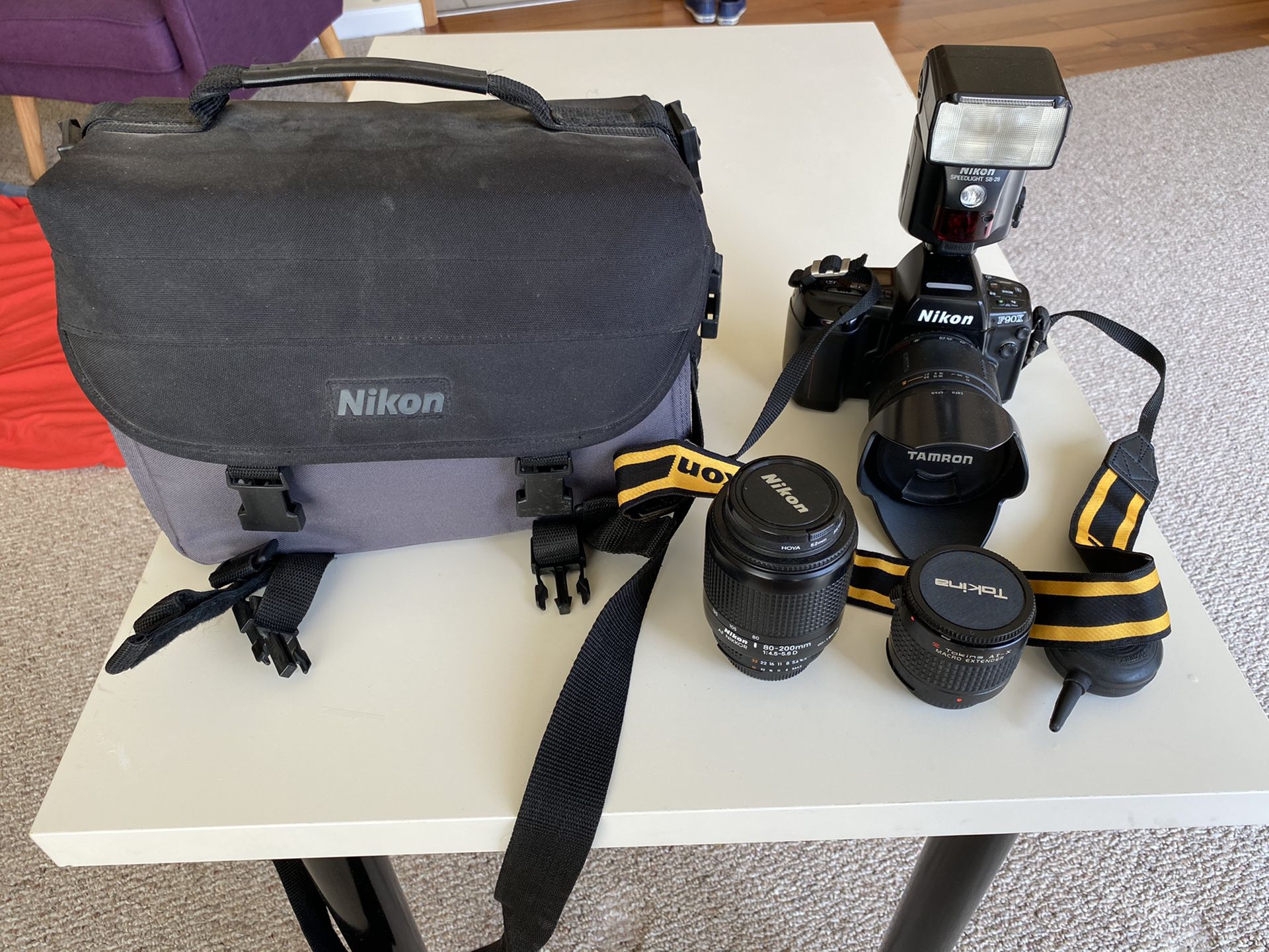 Nikon F90X film camera with lenses and accessories