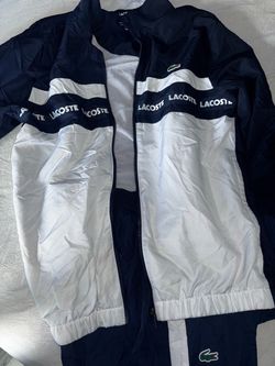 Lacoste Sport Printed Tracksuit color-block set with a matching full-zip jacket and track pants in blue and white. Lightweight diamond taffeta fabric 