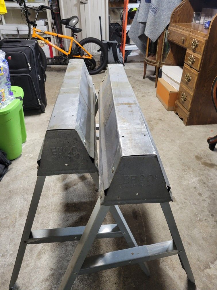 2× PRE OWNED EBCO GALVANIZED FOLDING SAW HORSES.