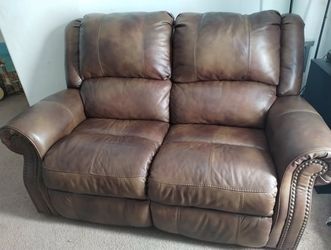 Brown leather reclining sofa
