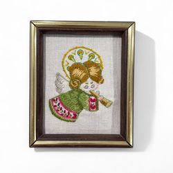 Vintage Crewel Christmas Angel Horn Framed Rectangular Wall Hanging   This vintage Christmas angel horn wall hanging is a beautiful addition to any ho