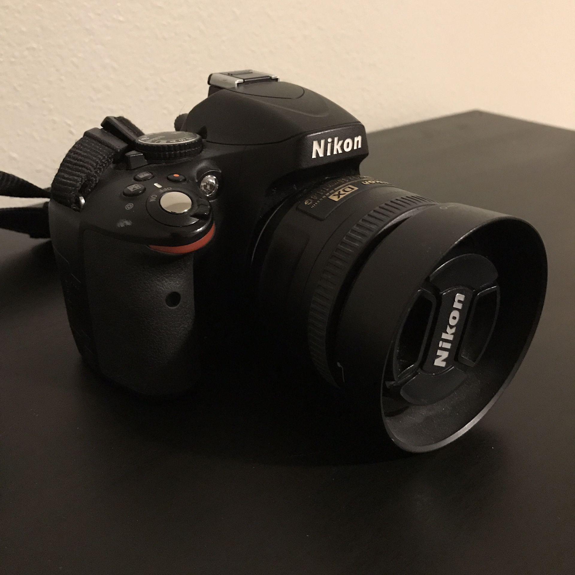 Nikon D1500 DSLR camera with two lenses, lens filters, hood, and soft case