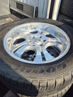 Set of 4 rims with Goodyear tire  with good thread