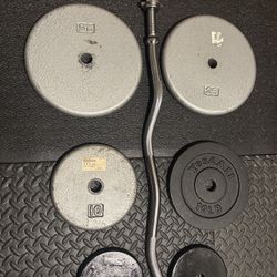 NEW Standard Steel Curl Bar with Cast Iron Weight Plates Gently Used pairs: 24#, 10 & 5 #. Total: 96 pounds