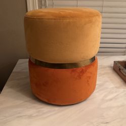 Two Tone Orange Ottoman With Gold Trim 