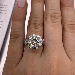 5.06 carat E VVS2 round lab diamond with floral marquise and round diamond band engagement ring