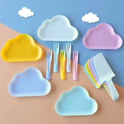 New cloud-themed party tableware sets in soft pastel pink and yellow.