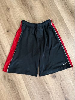 Nike vintage 2000s black basketball shorts with red accents  -tagged youth M, can fit mens xs,s (consider the measurements)  #basketball #athletic #vi