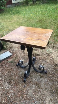 Small restaurant table wrought iron base wood top