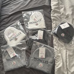 Moncler beanies selling in pairs!