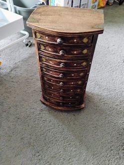 Table too chest of 8 small drawers 17" H. 9" W 7" D pickup only cash