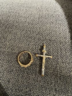 Gold ring with crucifix pendant