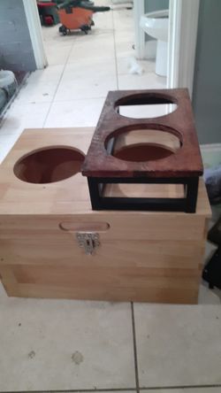 Holds dogfood or cat food in it in bowls fit in holes and a seperate dog or cat food bowl n water holder