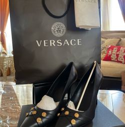 Black Versace letter pump with gold Medusa coins