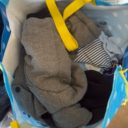 full bag of baby clothes