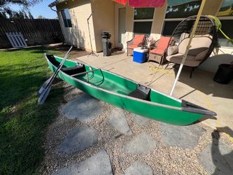 14 ft Coleman canoe and ores