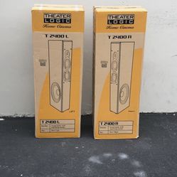  two boxes of Theater Logic T2400 Home Cinema 3-way tower speakers. 