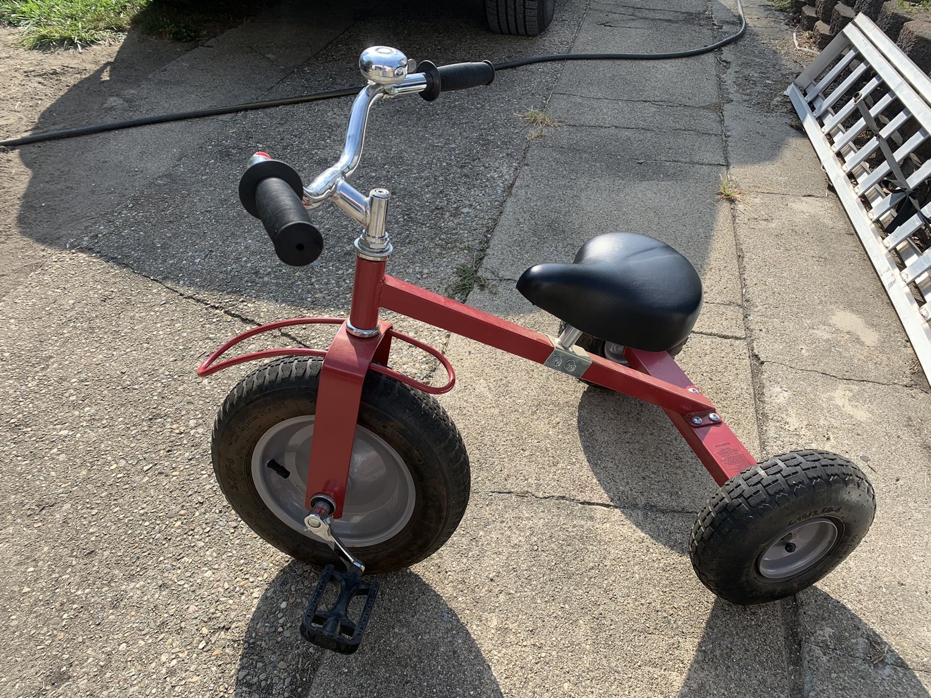 Really nice solid trike has the big tires hold air, adjustable seat as the. child grows