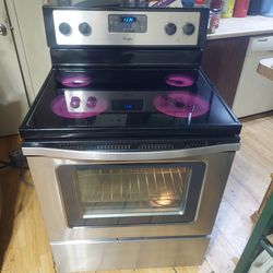 Nice, Black and Stainless Whirlpool Glass Top Stove With Self Cleaning Oven Works Excellent