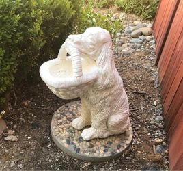 Cement dog with basket garden statue