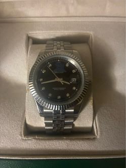 Man's watch boxing papers