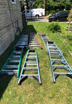 4 8 foot , 2 6 foot ladders Werner brand