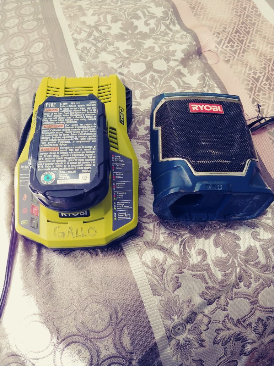 Ryobi radio with 18v lithium battery and battery charger.