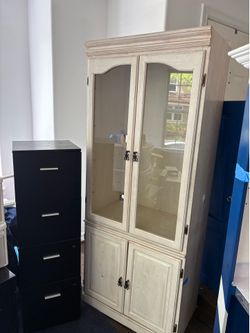 NEED TO GO ASAP WHITE SHELF AND BLACK Filing cabinet