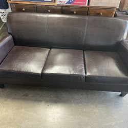 Brown Couch, 6ft Length, Synthetic Leather. No tears with minimal wear on the cushions.
