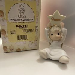 Precious Moments Angel holding peace star