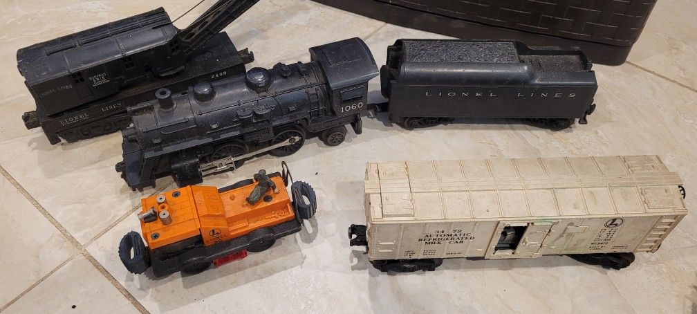 Assortment Of Older LIONEL TRAINS And Accessories