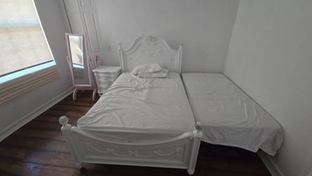 White Ornate Twin Bed Set and another twin bed