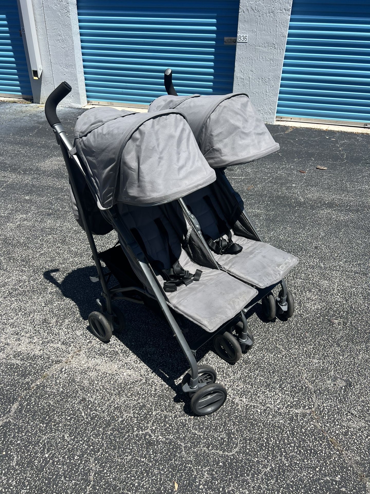 Joovy TwinGroove Ultralight Double Grey Stroller! Good condition! Light spots on seat and retractable shade see pics. Easy to fold!