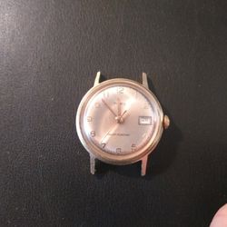 Timex- Date.  Manual wind / Automatic